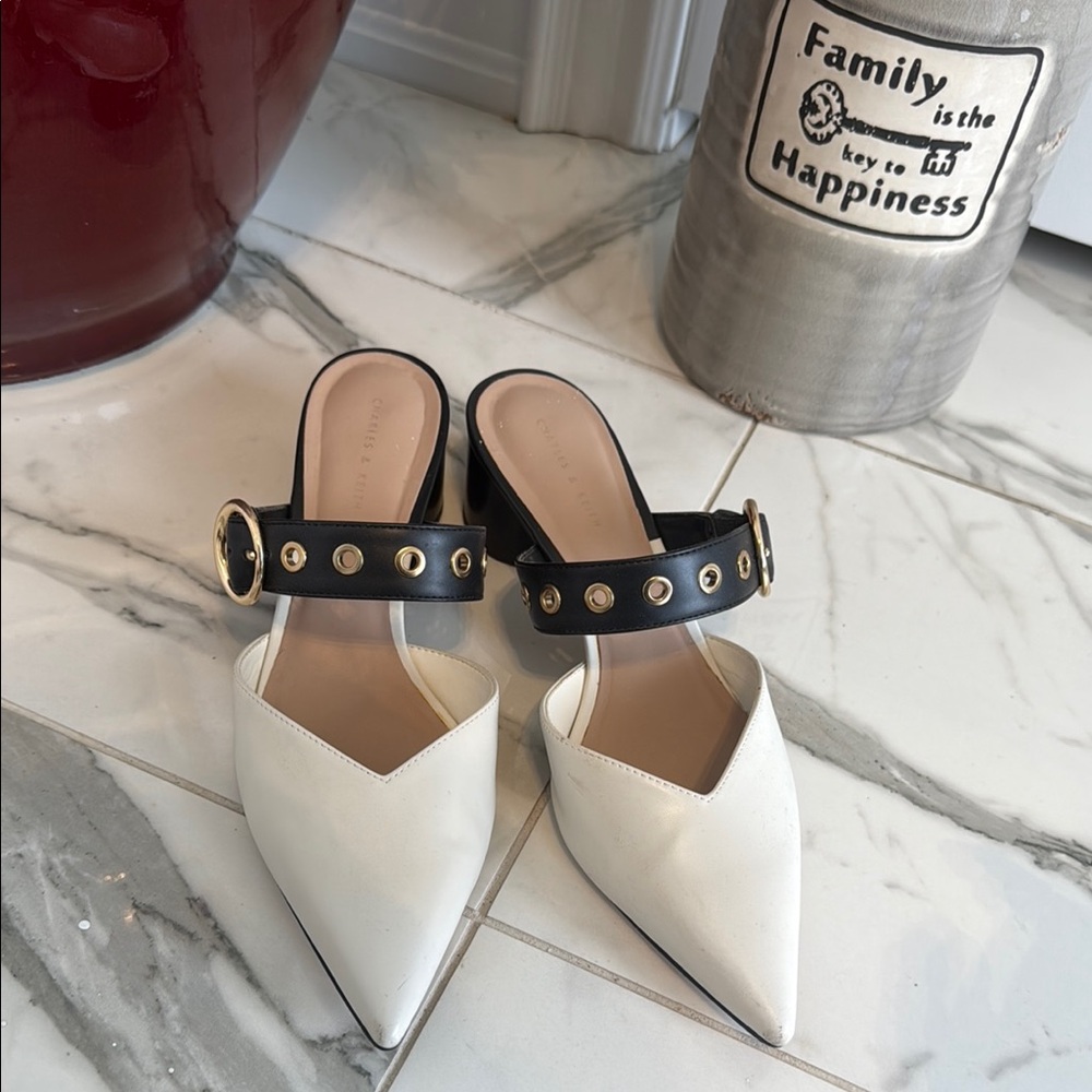 Sleek Black and White Mules with Studded Strap